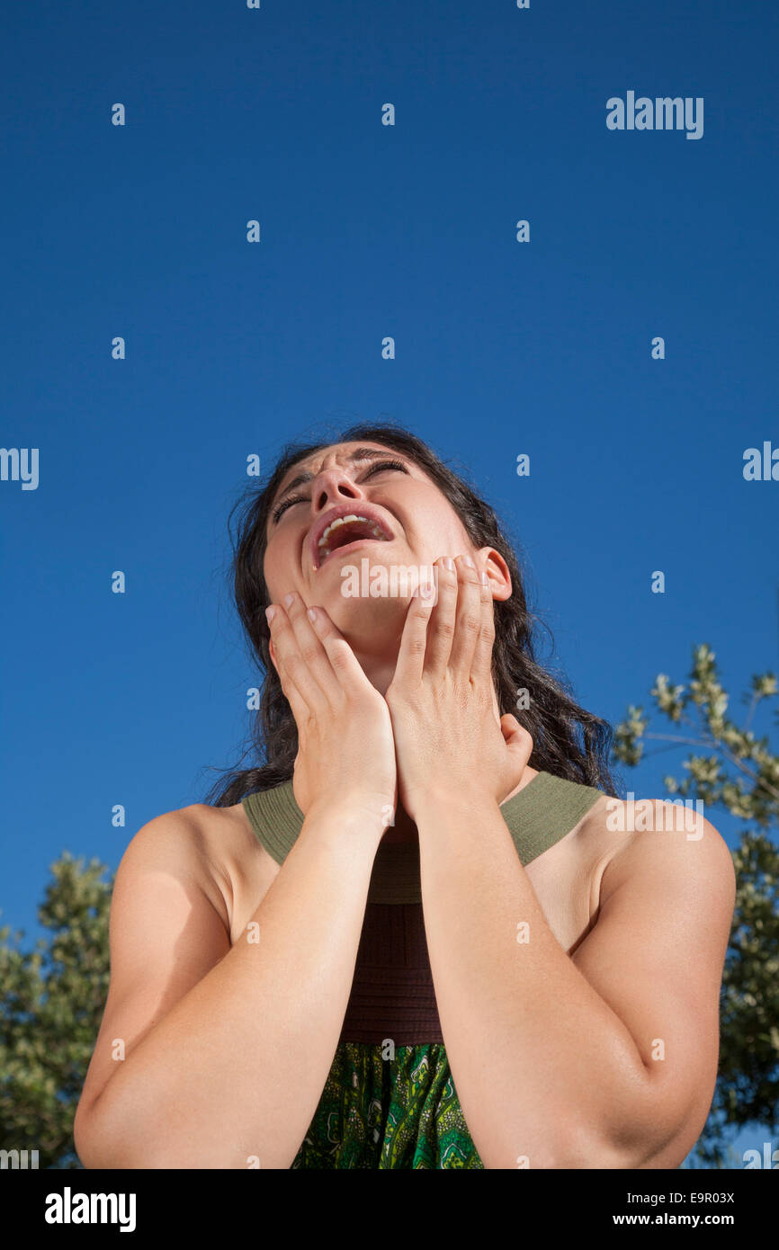 close up complainant woman in exterior background Stock Photo