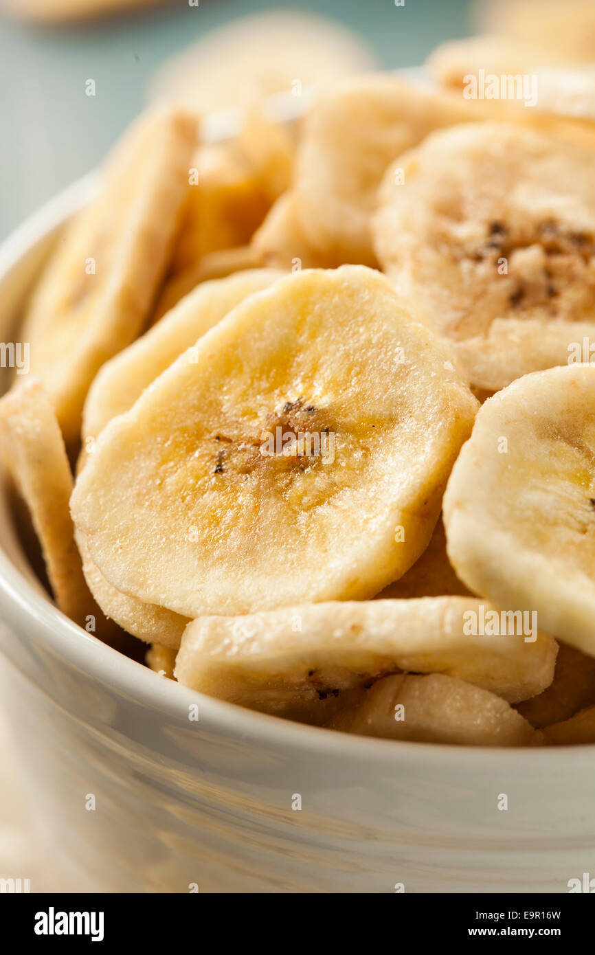 Homemade Dehydrated Banana Chips in a Bowl Stock Photo Alamy