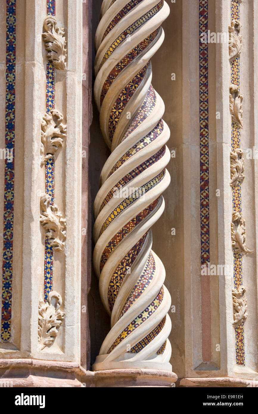 Orvieto, Umbria, Italy. Richly decorated spiral column on façade of the cathedral. Stock Photo