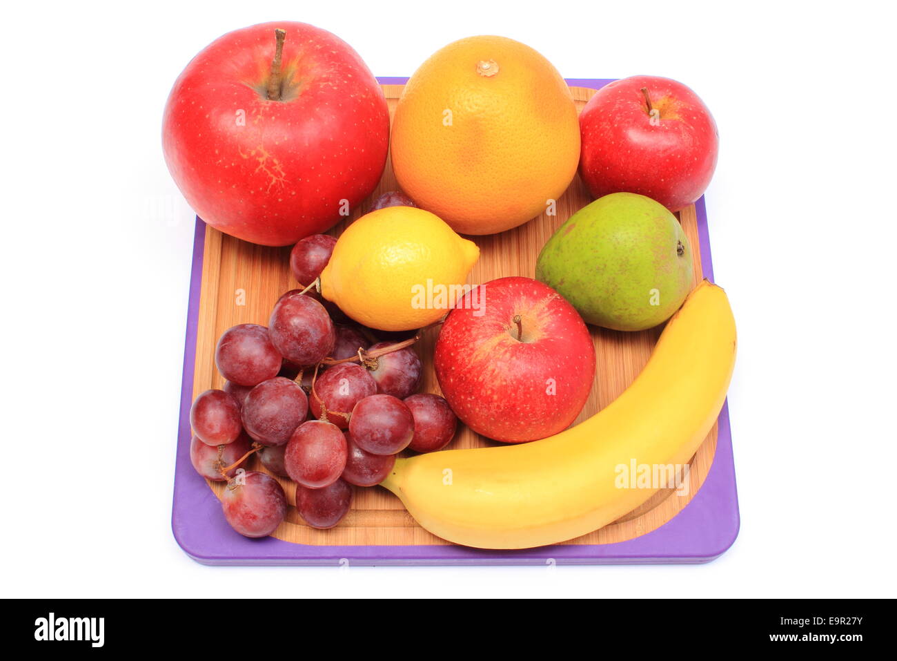 Fresh ripe raw vegetables on wooden cutting board Stock Photo by ratmaner