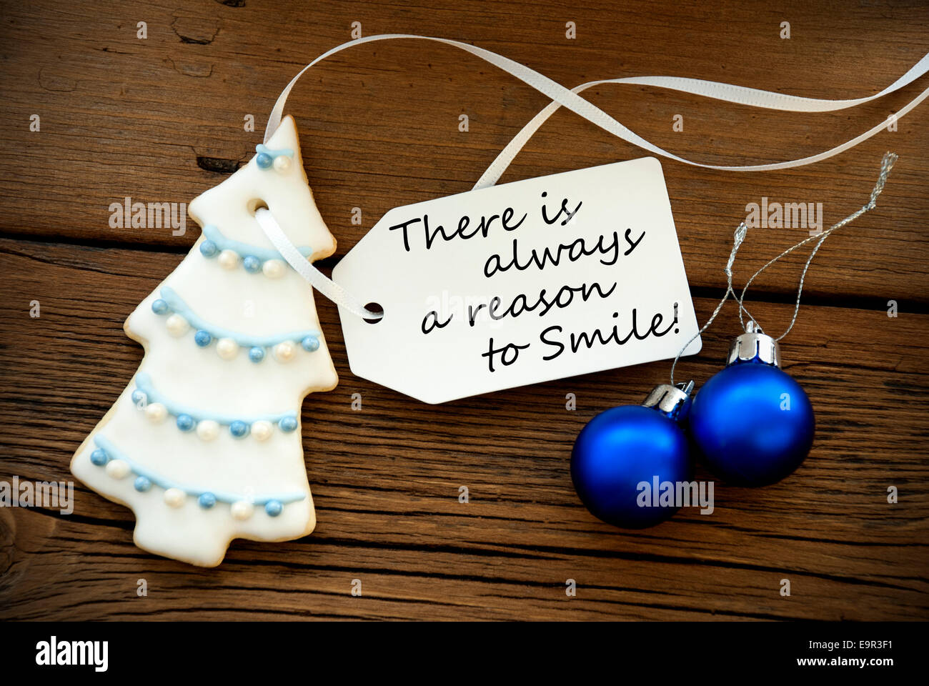 Christmas Tree Cookie And Two Blue Christmas Balls With White Label With Life Quote Saying There Is Always A Reason To Smile On Stock Photo