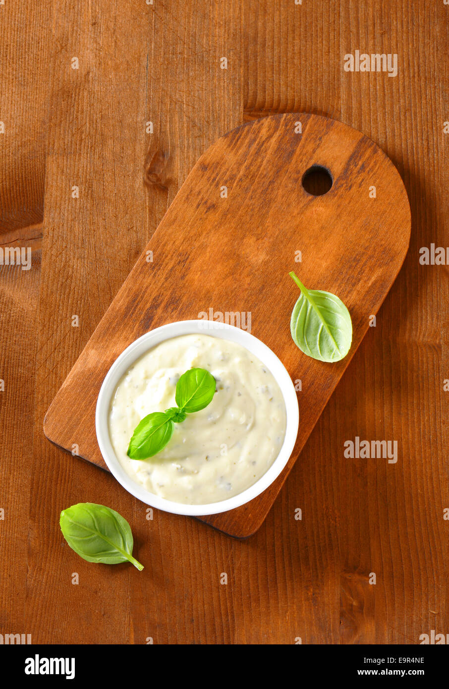 Creamy salad dressing made of mayonnaise, buttermilk, garlic, herbs, spices and grated cheese Stock Photo