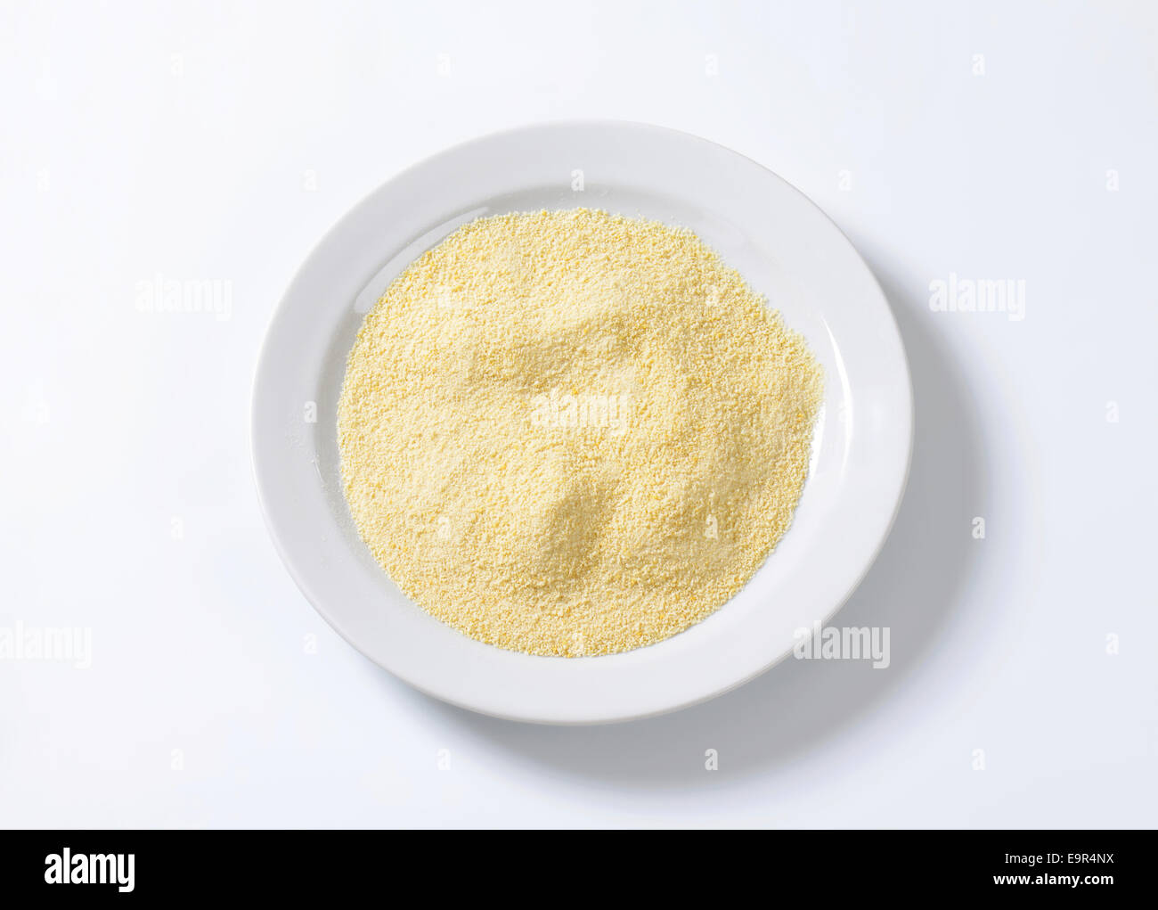 Pile of finely ground bread crumbs on plate Stock Photo