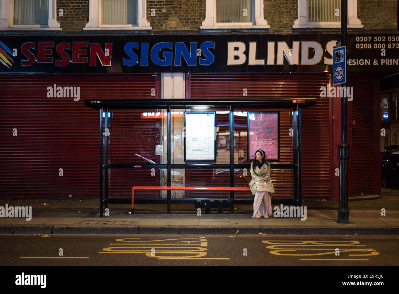 Bus stop uk london woman hi-res stock photography and images - Alamy