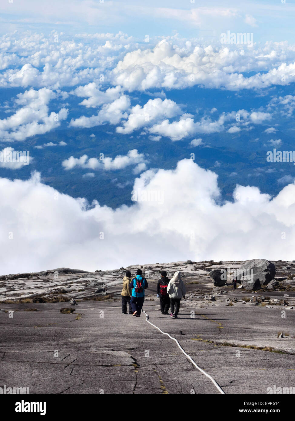 Hikers walking at the top of Mount Kinabalu in Sabah, East Malaysia. Stock Photo