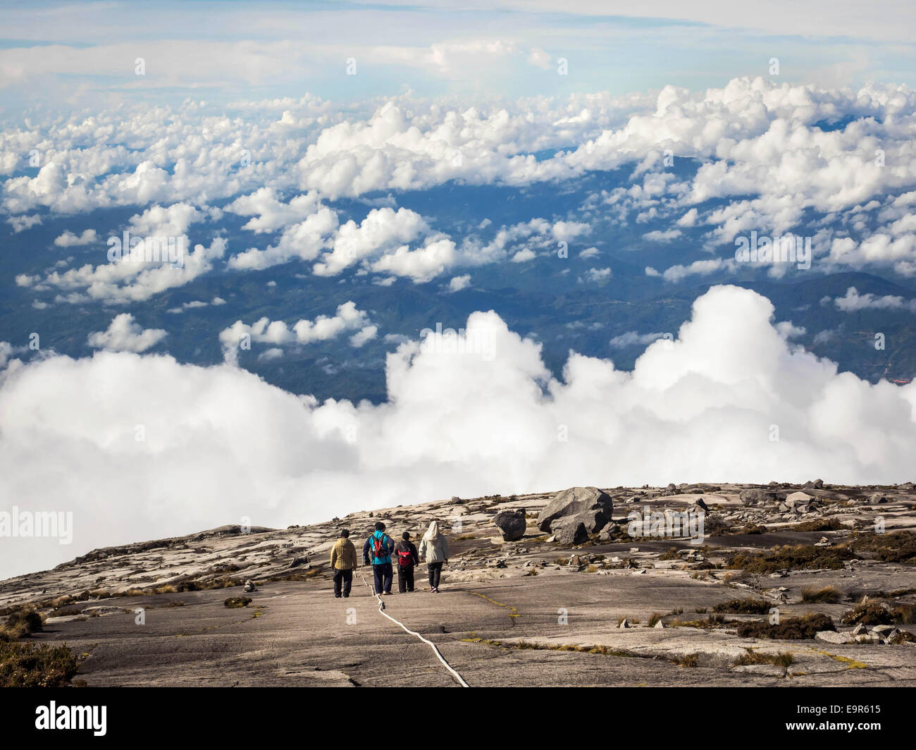 Hikers at the top of Mount Kinabalu in Sabah, East Malaysia. Stock Photo