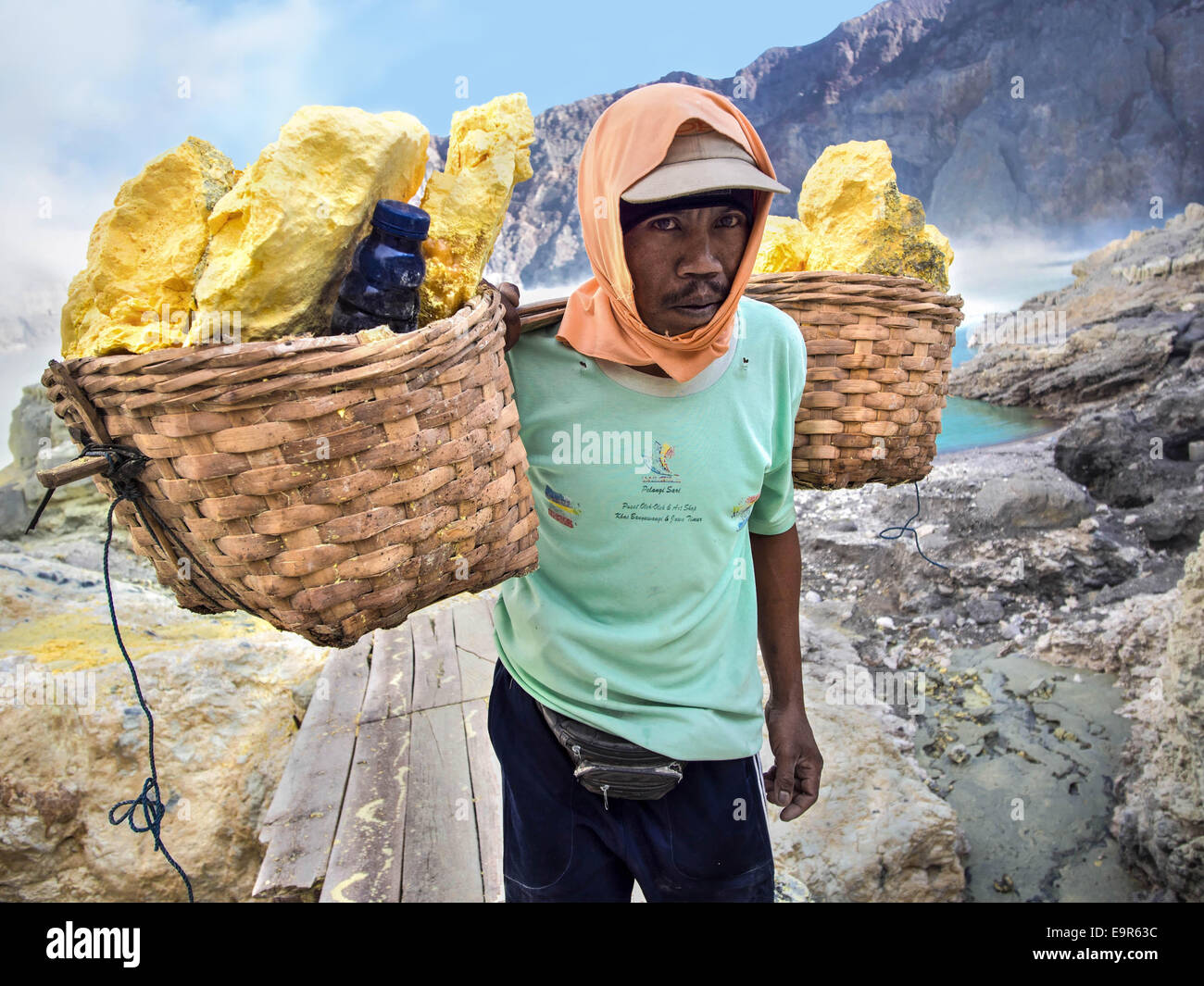 Portrait of a sulfur miner at Kawah Ijen volcano, East Java, Indonesia. Stock Photo