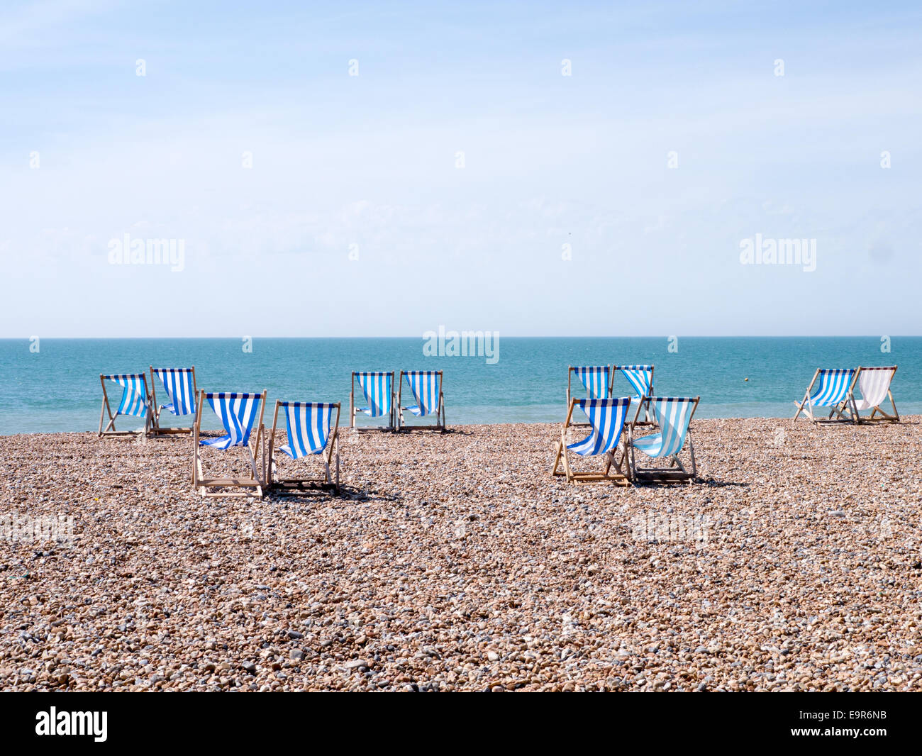 Blue and white deck chairs on Brighton Beach, East Sussex, UK Stock Photo Alamy