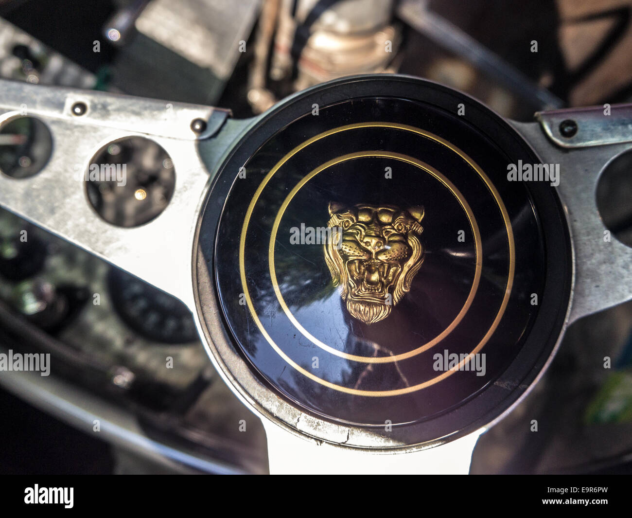 A classic Jaguar logo on a racing car steering wheel Stock Photo