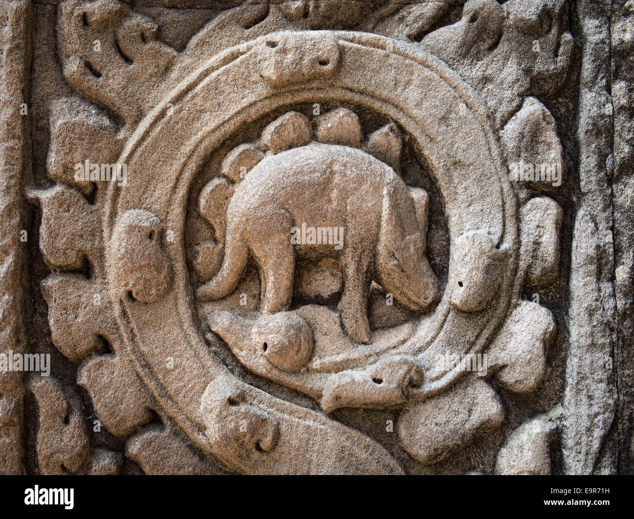Mysterious bas relief carving depicting a dinosaur at the ancient Ta Prohm temple at Angkor, Siem Reap, Cambodia. Stock Photo