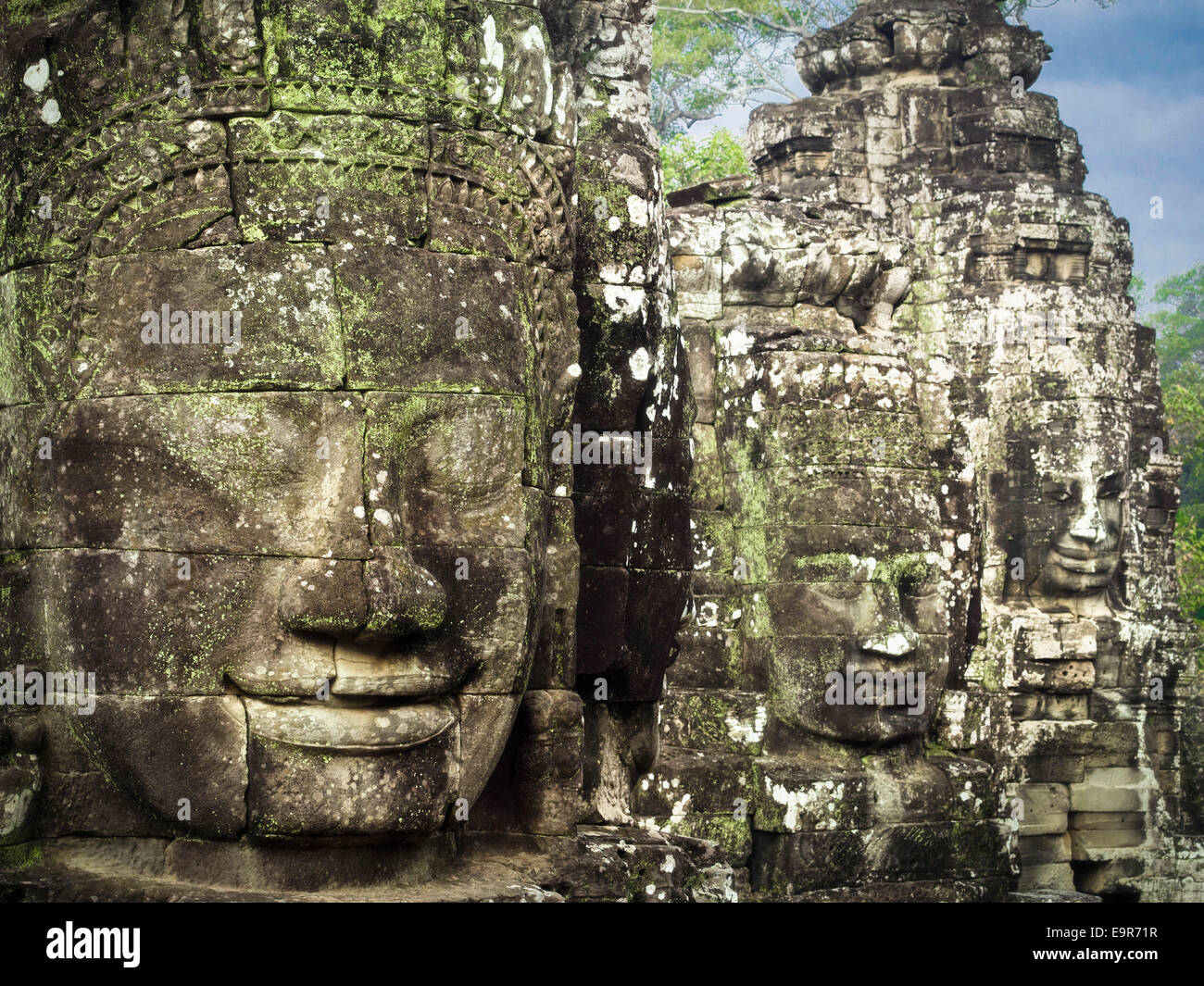 Giant stone faces at ancient Bayon Temple at Angkor, Siem Reap, Cambodia. Stock Photo
