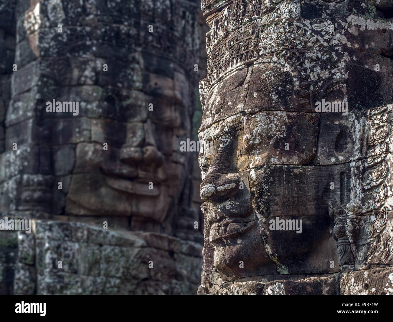 Giant stone faces at ancient Bayon Temple at Angkor, Siem Reap, Cambodia. Stock Photo