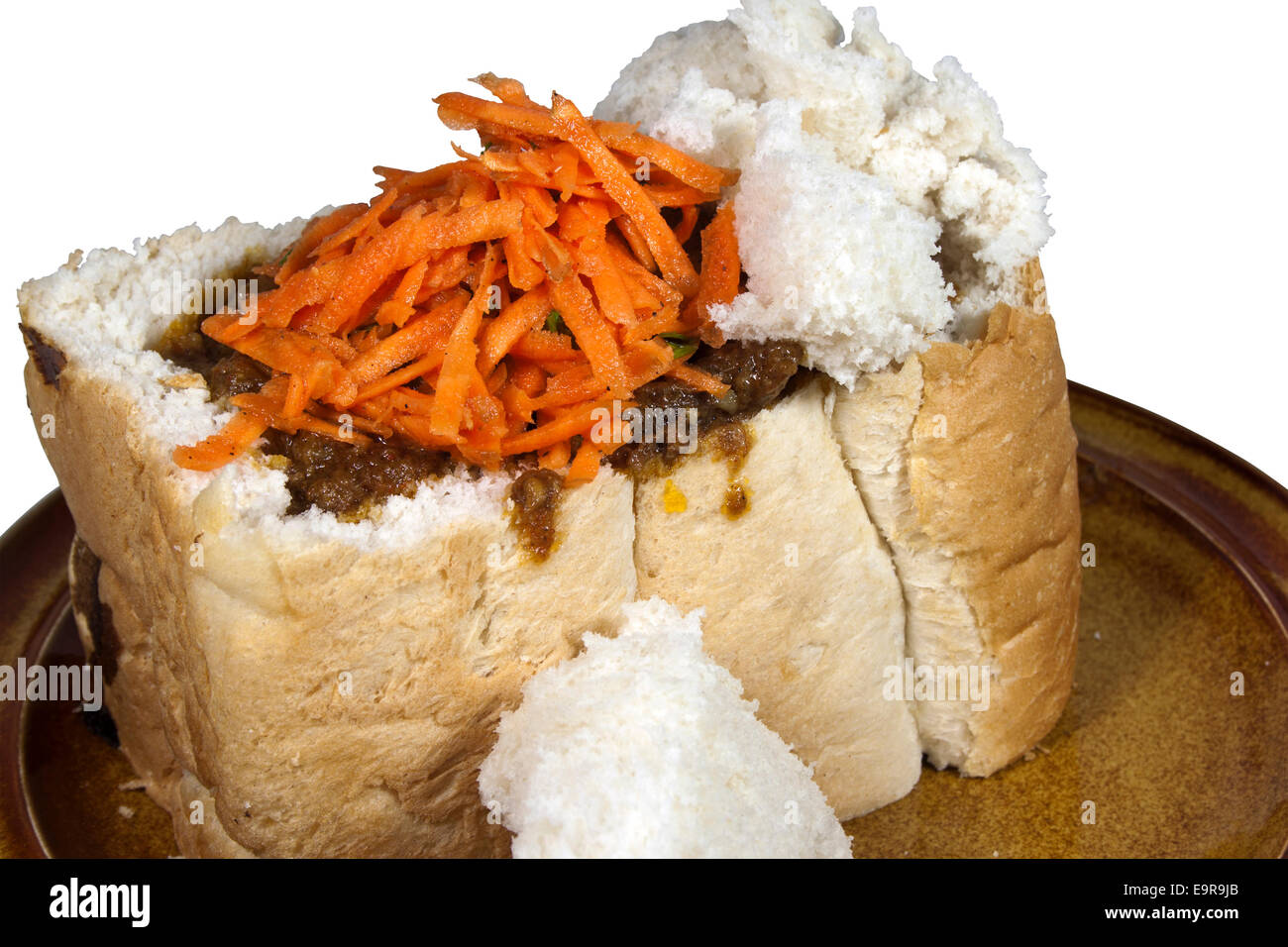 traditional durban mutton bunny chow with carrot and coriander sambal Stock Photo Alamy
