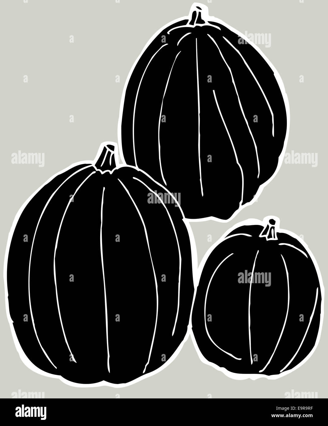Set of three black pumpkins over gray background Stock Photo - Alamy