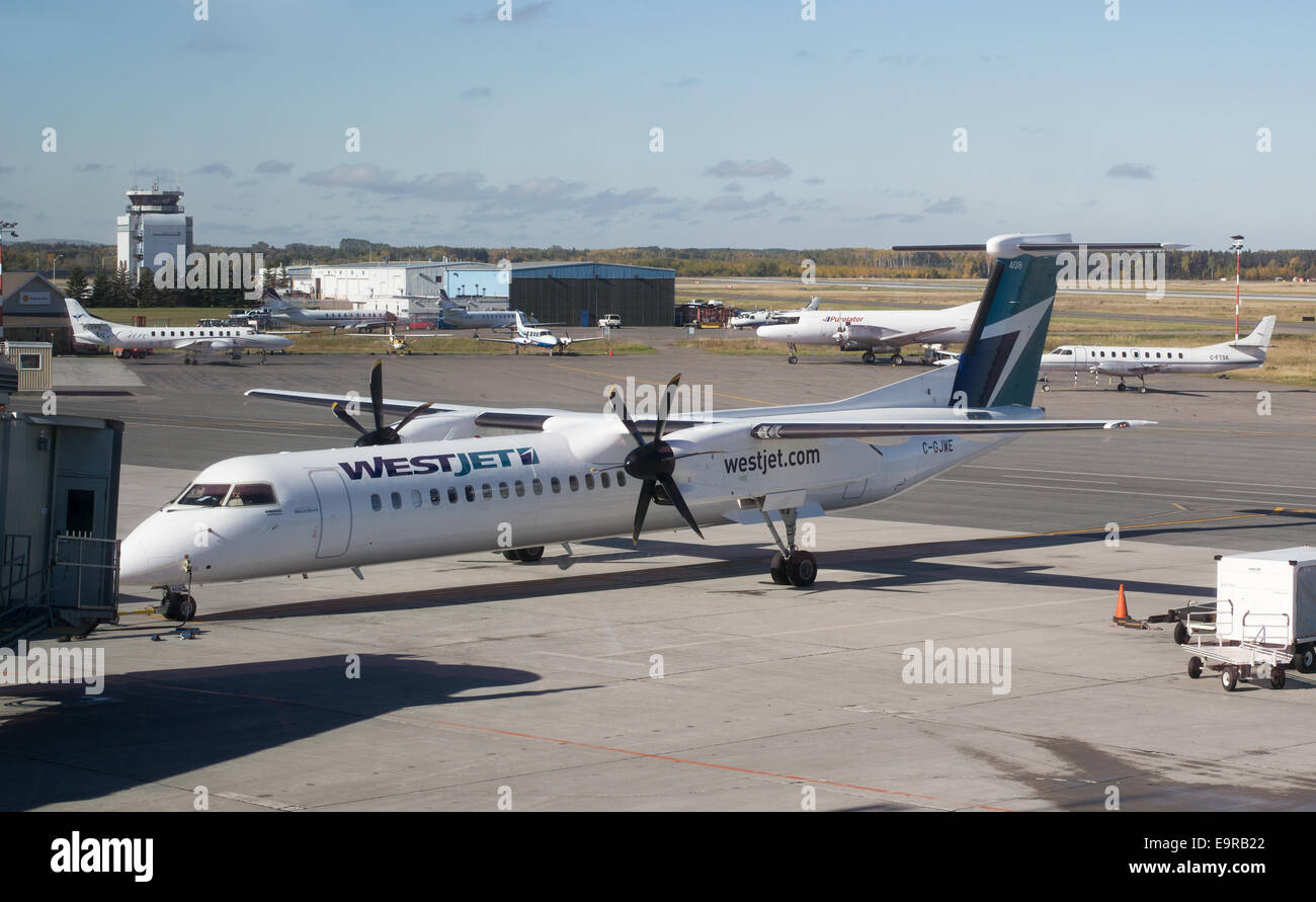 WestJet Q400 aircraft by Bombardier at Thunder Bay airport, Ontario, Canada. Stock Photo