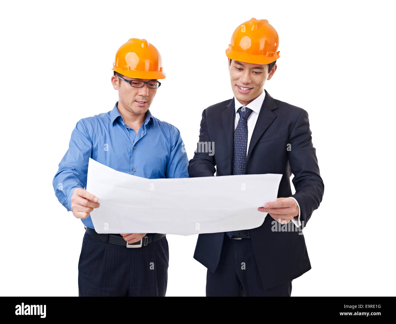 businesspeople with architectural drawing Stock Photo