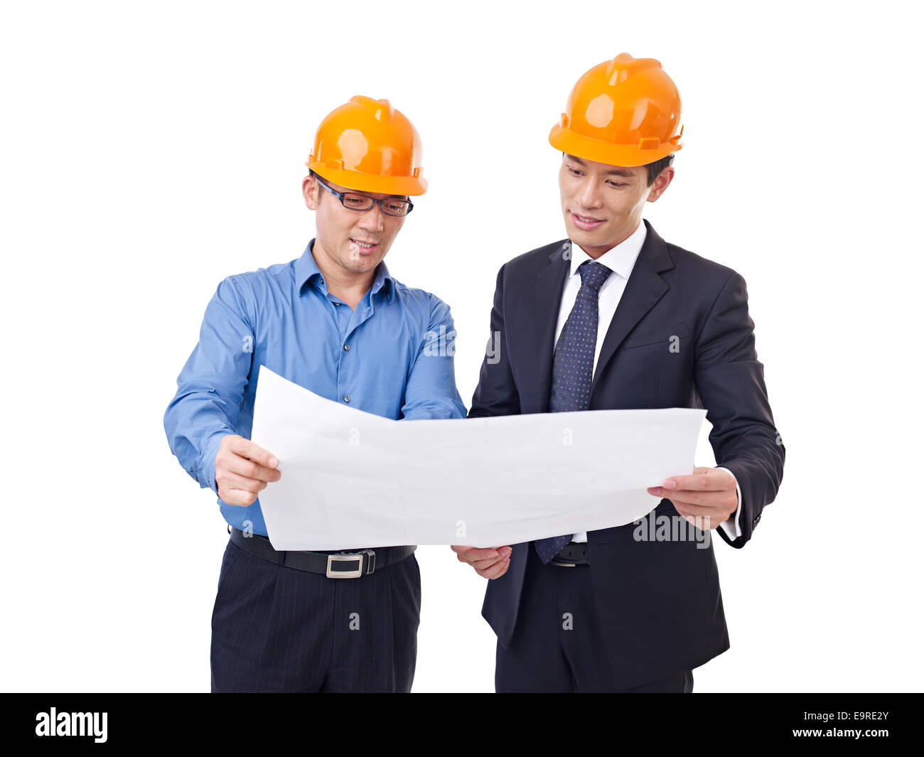 businesspeople with architectural drawing Stock Photo