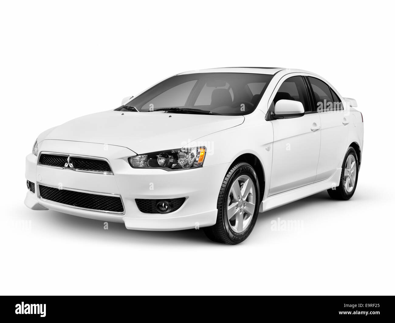 White 2014 Mitsubishi Lancer compact car isolated on white background with clipping path Stock Photo