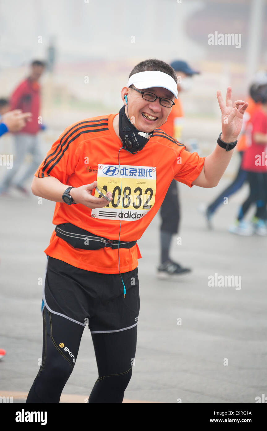 Happy runner at the 2014 Beijing Marathon Stock Photo Alamy