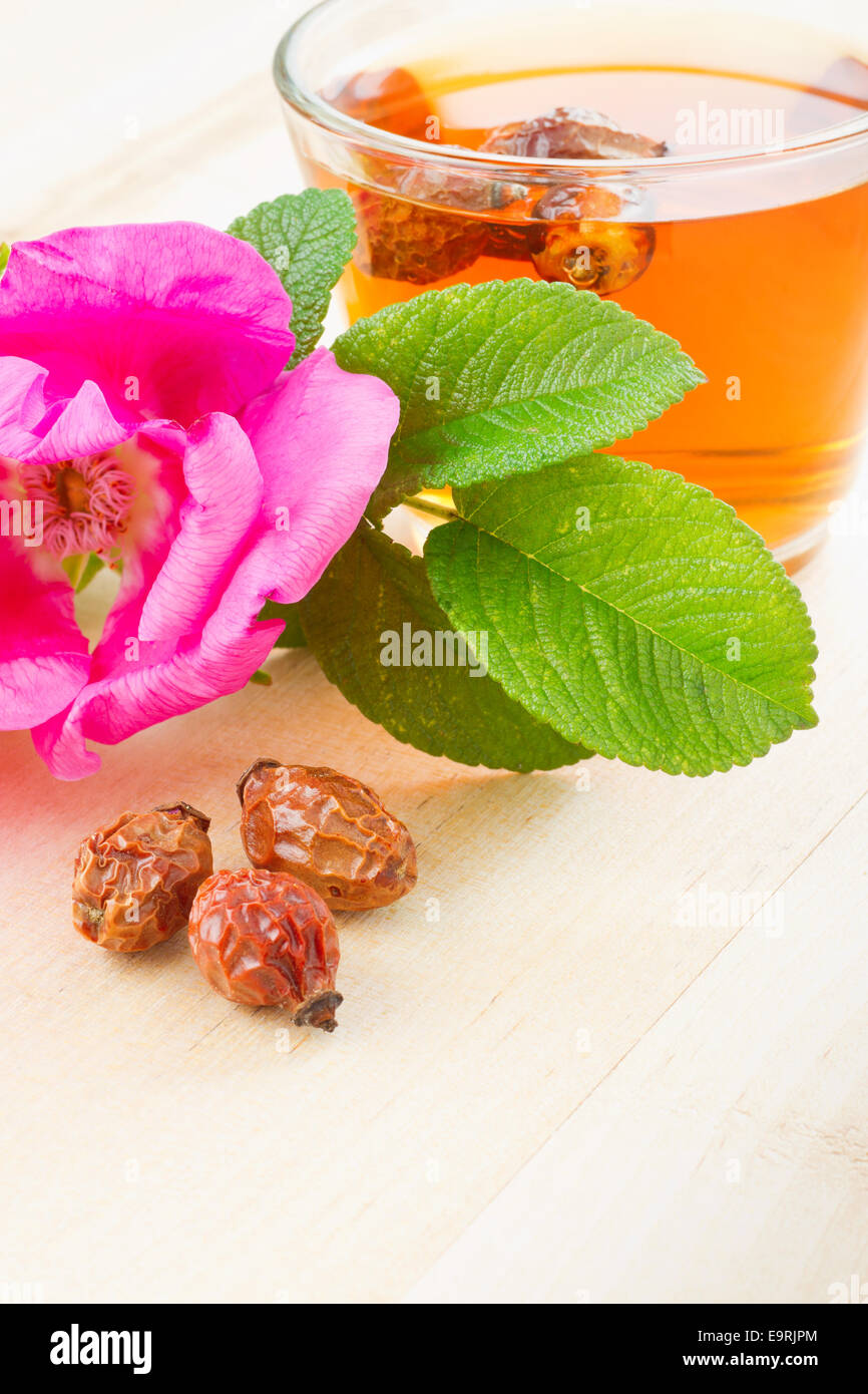 rose hips tea and rosehip flowers Stock Photo Alamy
