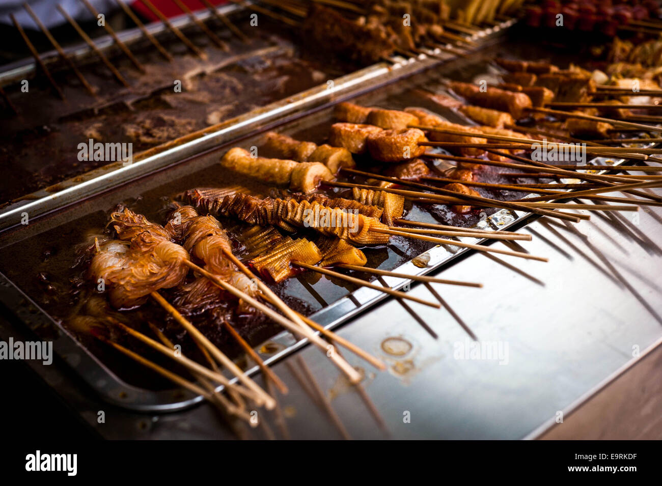 Tofu skewers on a street food kiosk on the streets of Wudaokou, Beijing