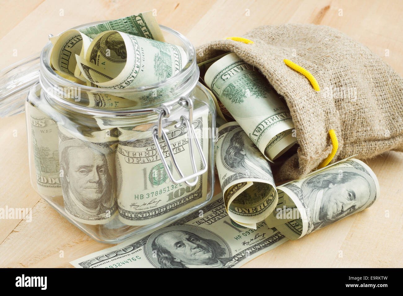 dollar banknote  in  glass jar and bag of money Stock Photo