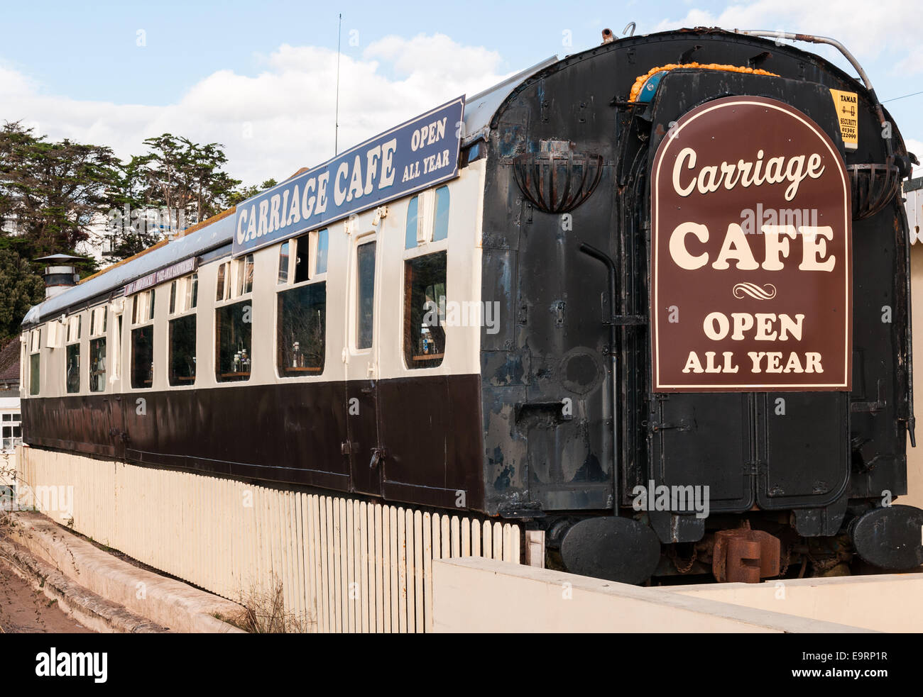 An old vintage railway carriage that has been converted into a diner cafe café with  sign saying Open All Year at Exmouth Stock Photo
