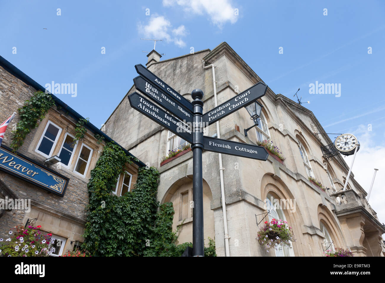 The Town Hall, Flemish Weaver public house and signpost in Corsham, Wiltshire Stock Photo