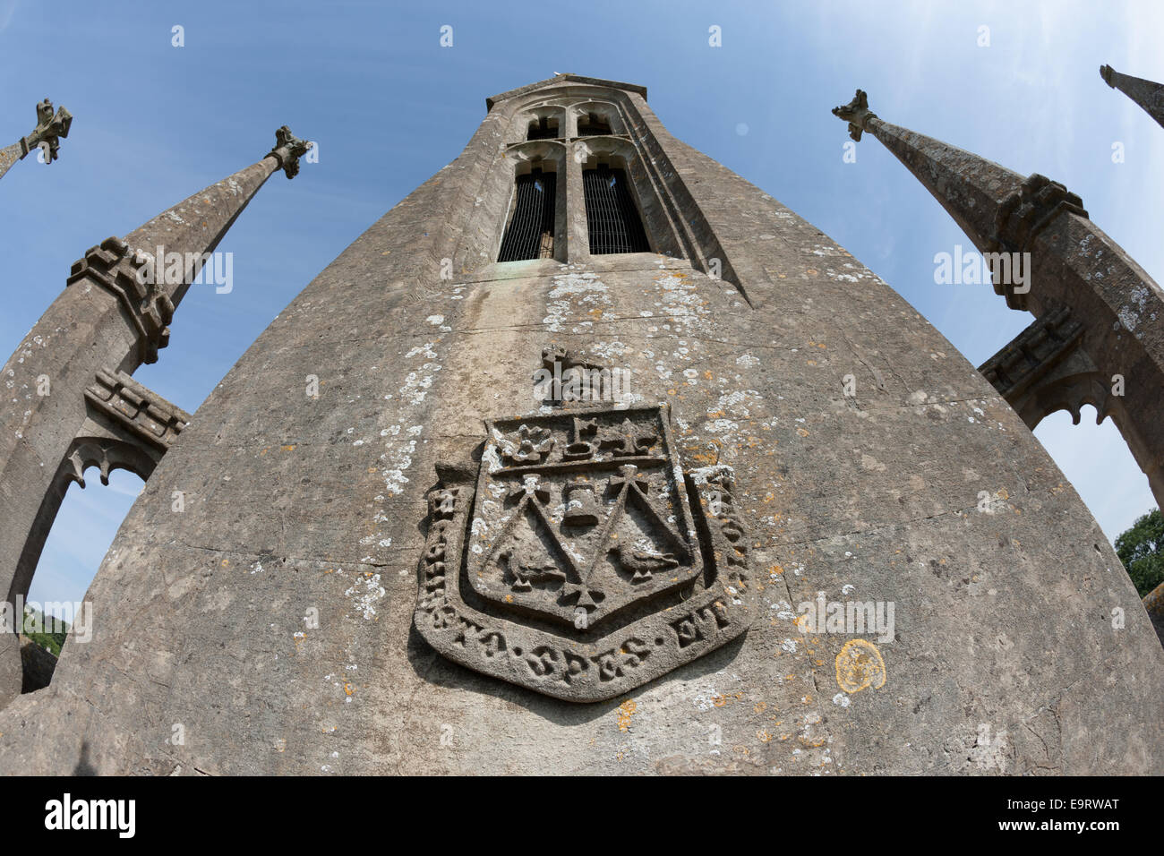 The spire of Corsham Church with coat of arms Stock Photo