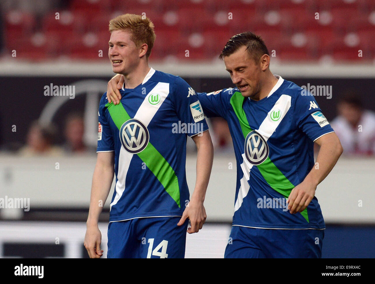 Wolfsburg's Kevin De Bruyne (L) and Ivica Olic (R) celebrates Bruyne's 3-0 goal during the German Bundesliga match between VfB Stuttgart and VfL Wolfsburg at the Mercedes-Benz Arena in Stuttgart, Germany, 01 November 2014. Photo: BERND WEISSBROD/dpa (ATTENTION: Due to the accreditation guidelines, the DFL only permits the publication and utilisation of up to 15 pictures per match on the internet and in online media during the match.) Stock Photo
