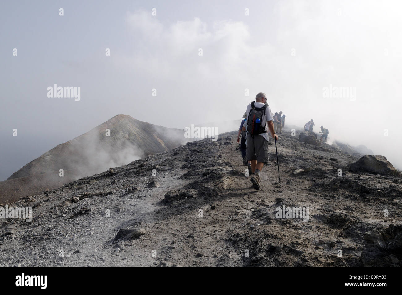 Vulcano Ridge Hikers on the ridge of the volcanic crater Vulcano Island Sicily Italy ...