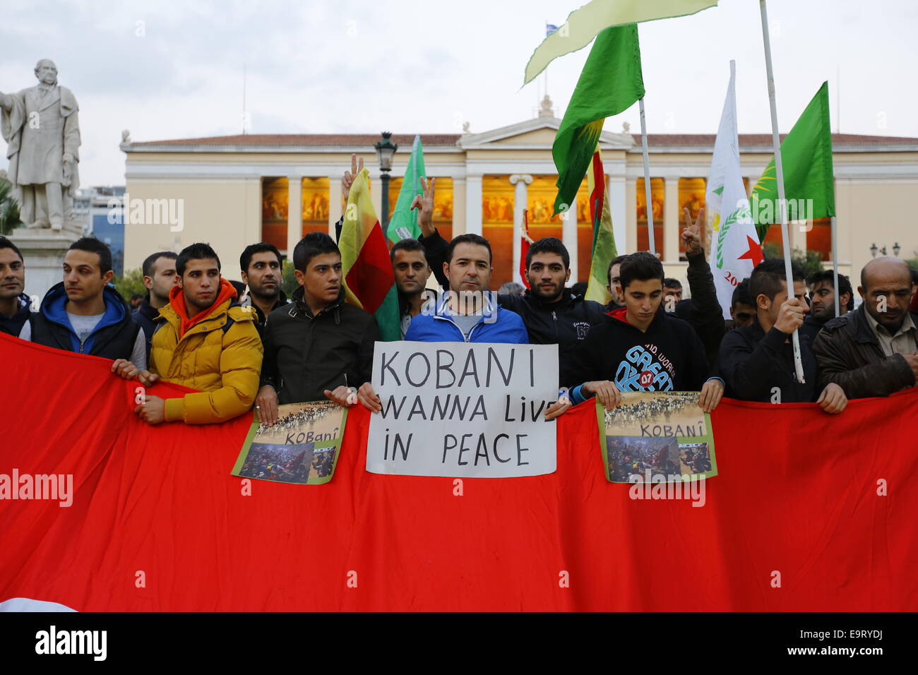 Athens, Greece. 1st November 2014. Kurdish protesters hold a sign that reads 'Kobani - wanna live in peace'.  Kurds living in Greece protested against attacks by Islamic State fighters on the city of Kobane in Syria. They were supported by two politicians from executive committee of the Party of the European Left that meet in Athens for the weekend. Credit:  Michael Debets/Alamy Live News Stock Photo