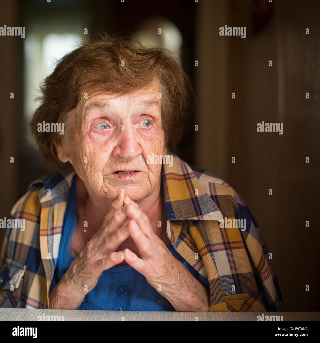 Old restless emotional woman during a conversation, close-up portrait. Stock Photo