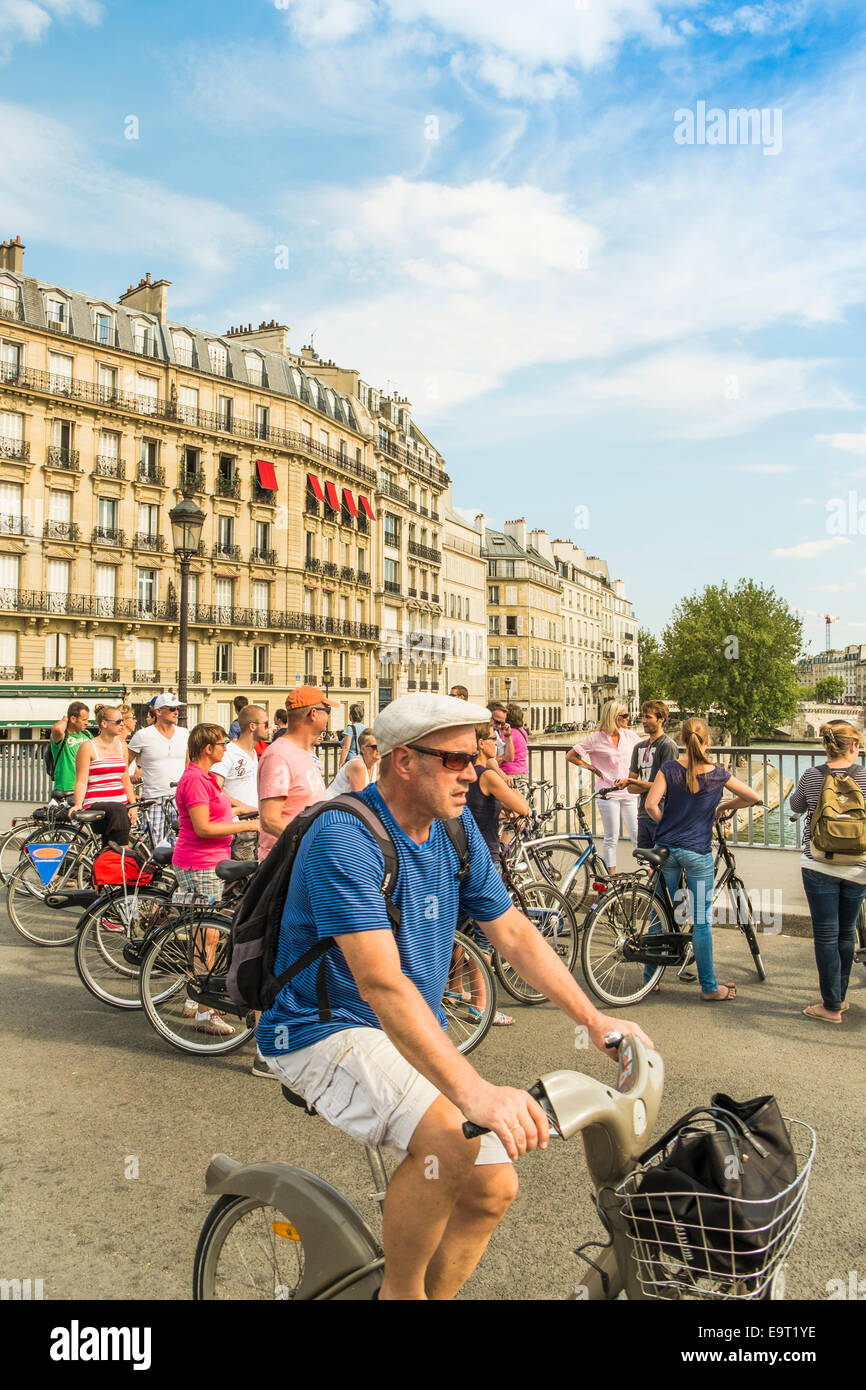 group of tourists during a guided bicycle tour of paris, paris, ile de ...