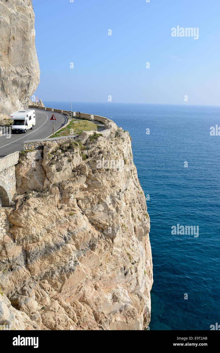Motorhome on a scenic corniche high above the Mediterranean Sea. Capo Noli, Province of Savona, Liguria, Italy. Stock Photo