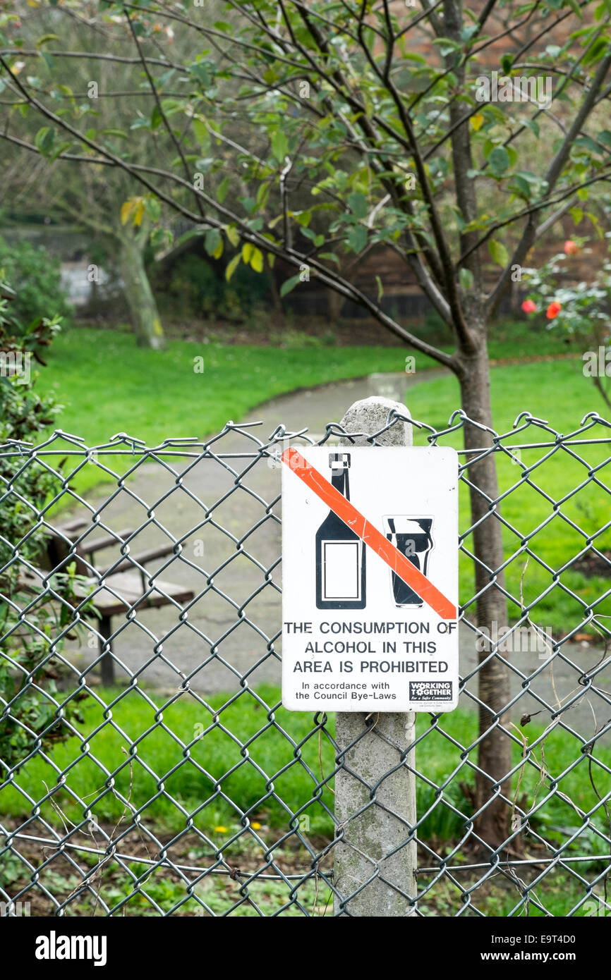 Alcohol free zone sign on fence outside of public park Stock Photo
