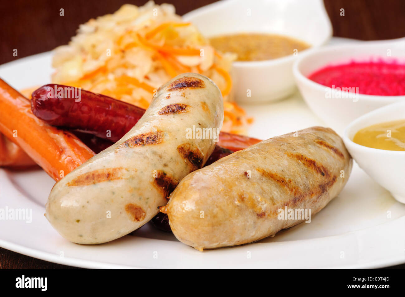 German sausage with cabbage and sauces Stock Photo Alamy