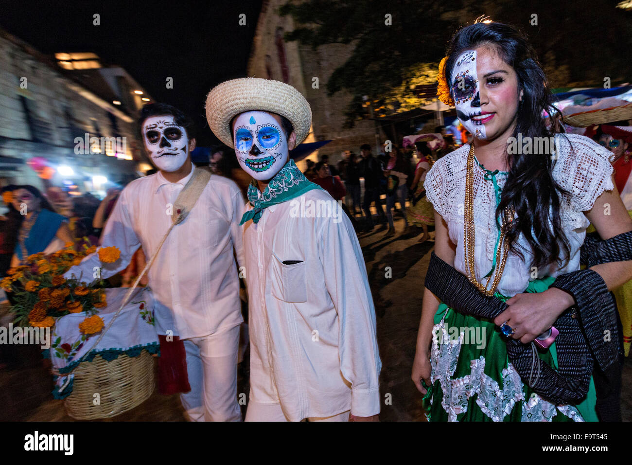 Costumed dancers at a Comparsa, or parade during the Day of the Dead Festival known in spanish as D’a de Muertos on October 31, 2014 in Oaxaca, Mexico. Stock Photo