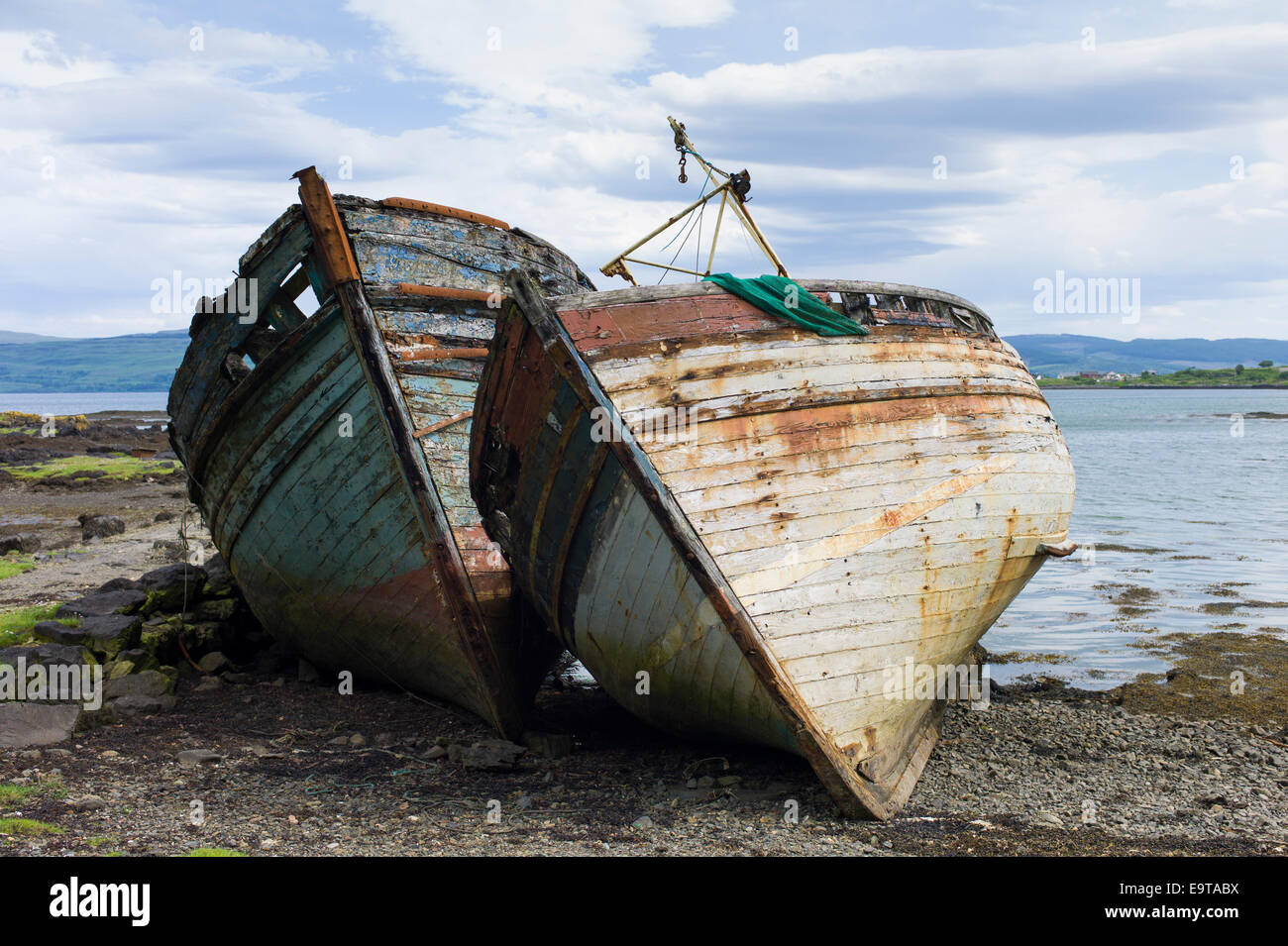 Disused rusty derelict fishing boats at Salen Bay in Sound of Mull on Isle of Mull in the Inner Hebrides and Western Isles, West Stock Photo