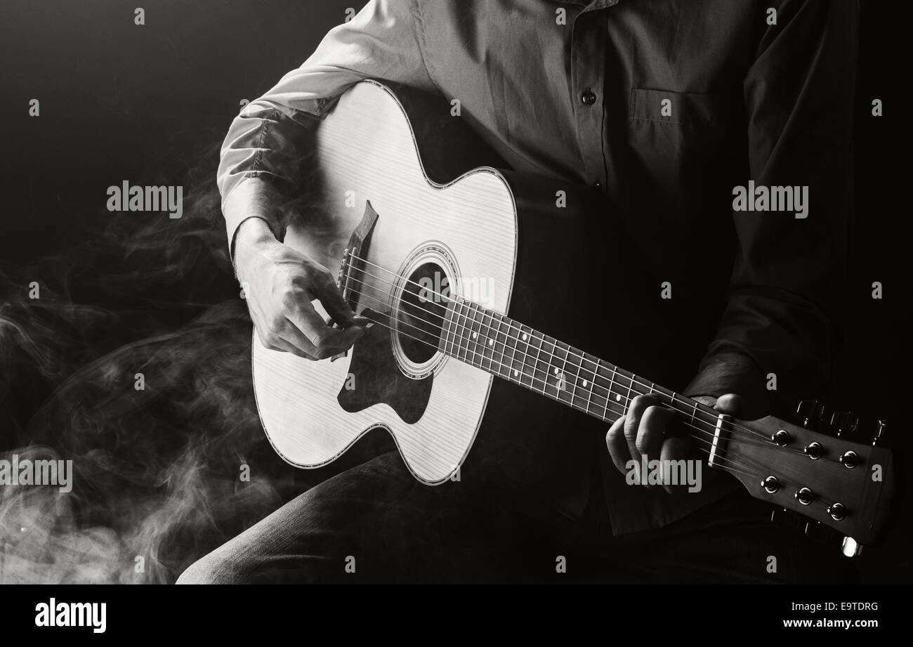 Guitarist playing acoustic guitar. Unplugged performance Stock Photo