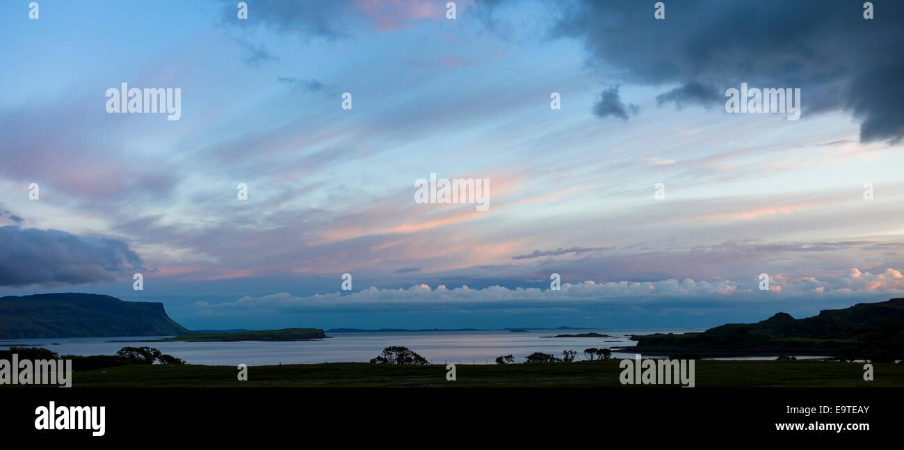 Panoramic sky scene view of pink and blue pastel colours over Loch Na Keal at sunset on Isle of Mull, the Inner Hebrides and Wes Stock Photo