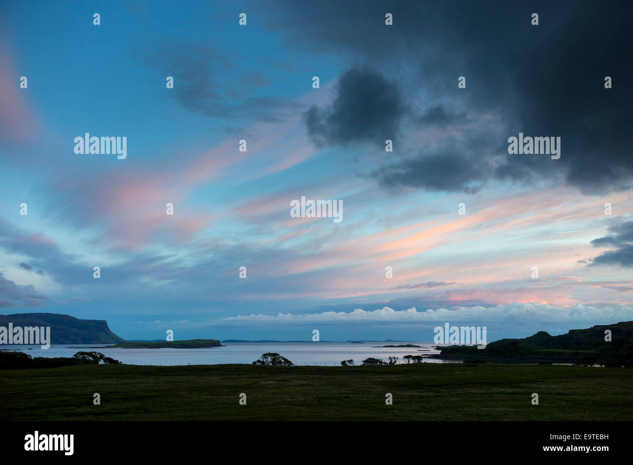 Panoramic sky scene view of pink and blue cerulean pastel colours over Loch Na Keal at sunset on Isle of Mull, the Inner Hebrides and Wes Stock Photo