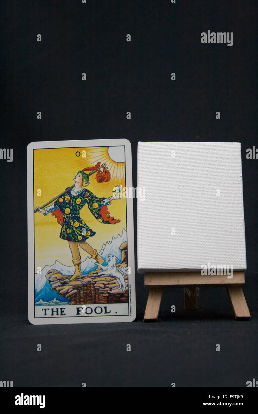 The Fool tarot card next to a blank easel. Stock Photo
