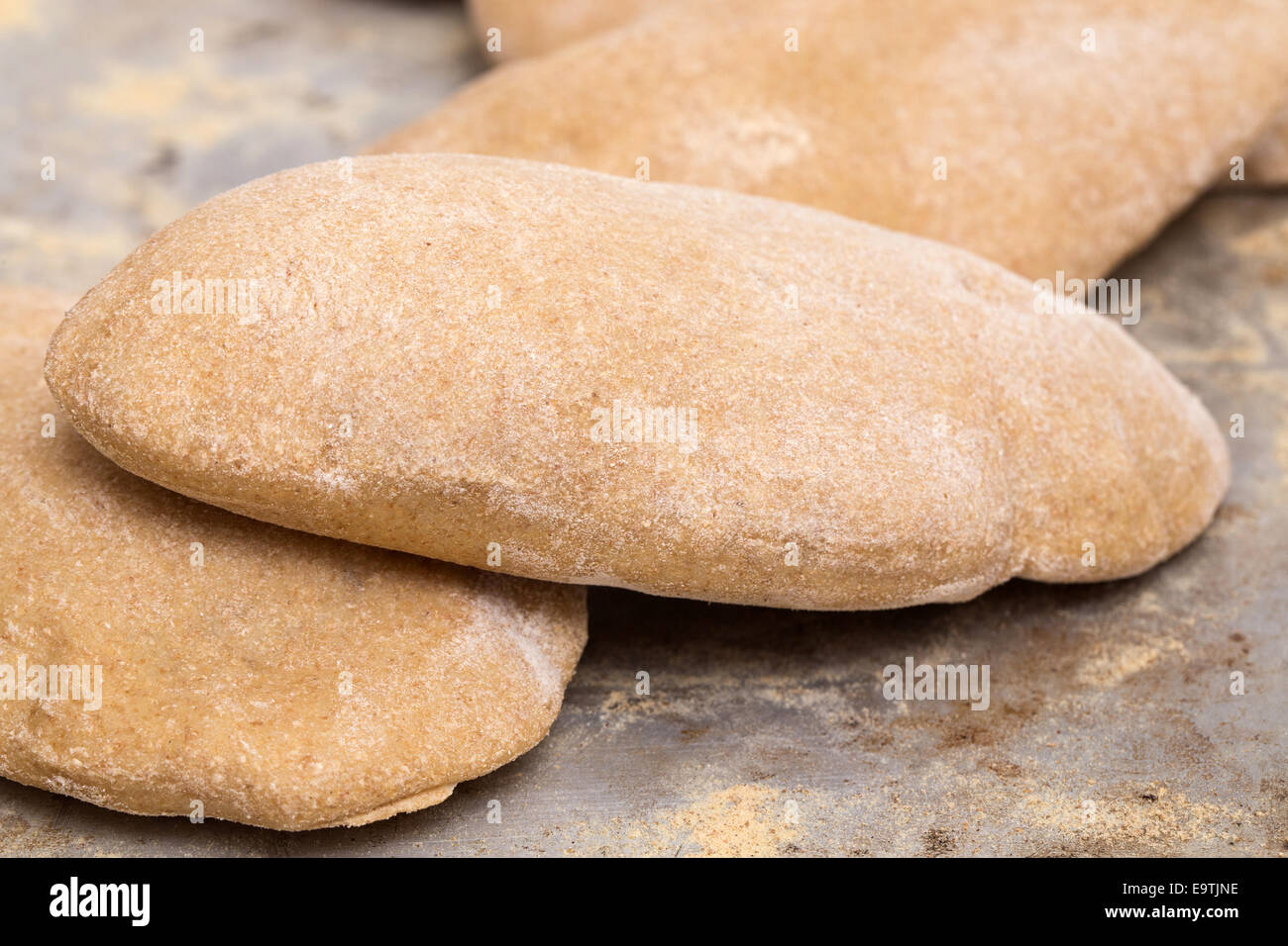 Loaves of traditional Egyptian homemade brown pita bread, fresh from
