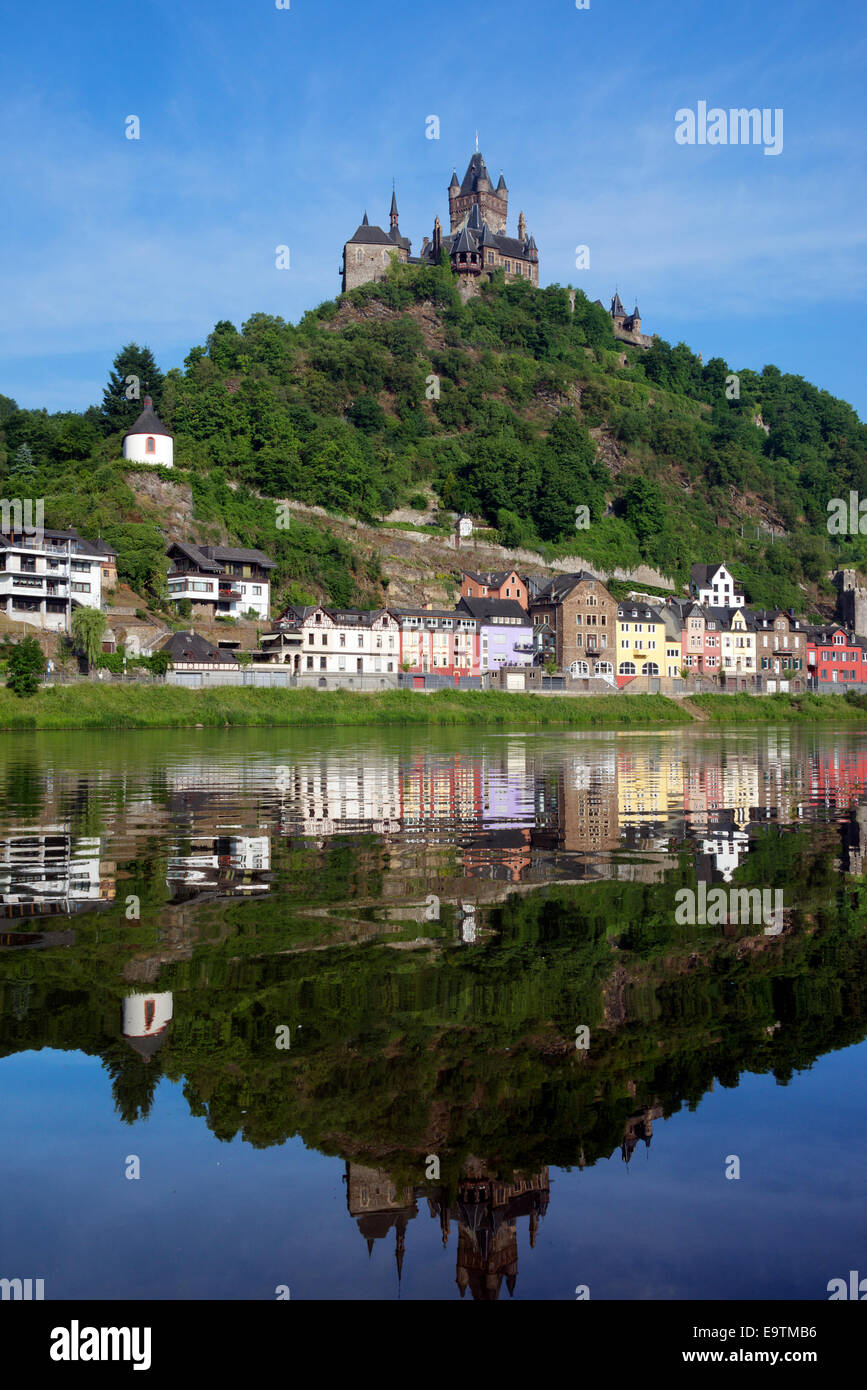 Reflection of colourful river front buildings and Reichsburg Castle Cochem Moselle River Germany Stock Photo