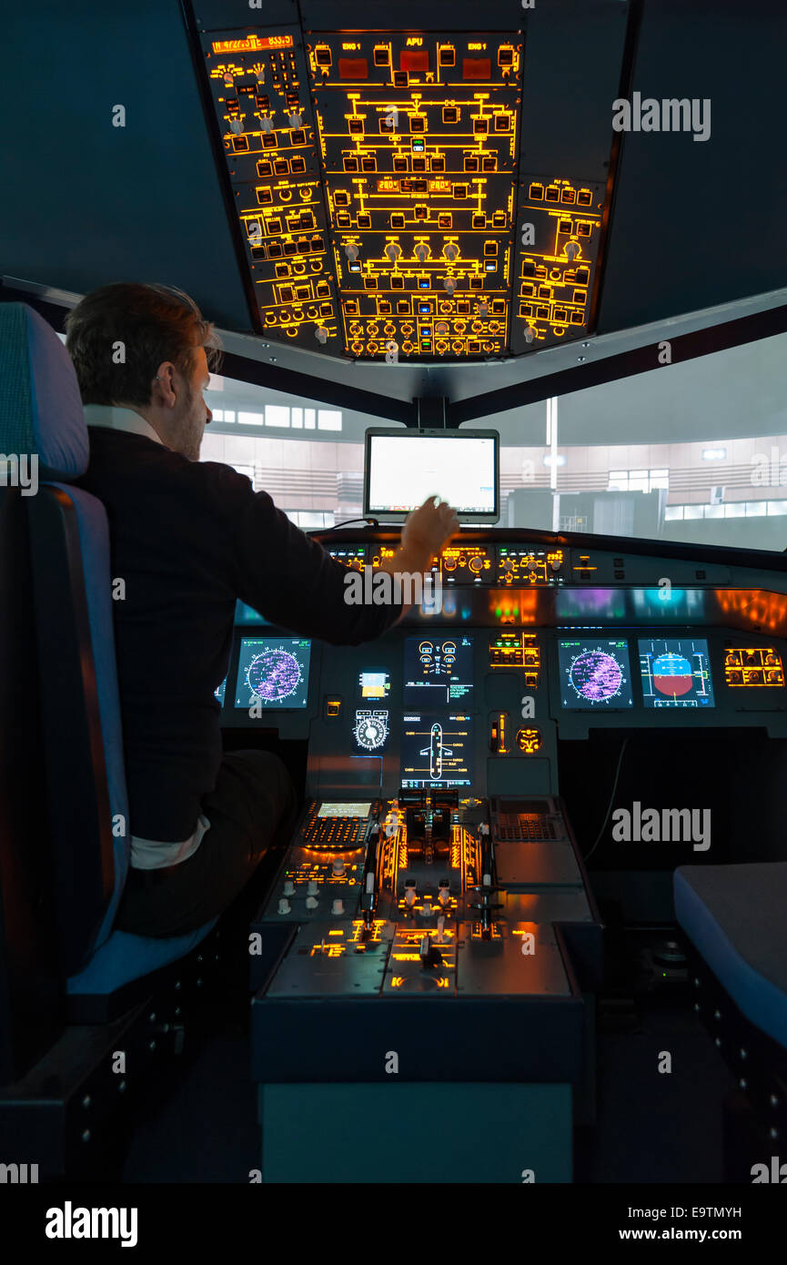 Cockpit of an Airbus A320 flight simulator that is used for training of professional airline pilots (preparing for takeoff) Stock Photo