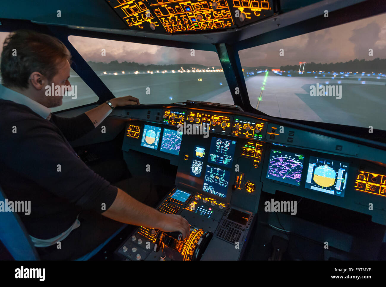 Cockpit of an Airbus A320 flight simulator that is used for training of professional airline pilots (preparing for takeoff) Stock Photo