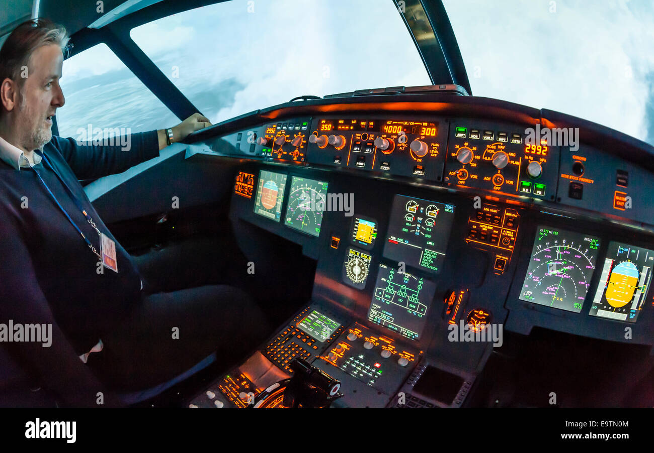 Cockpit of an Airbus A320 flight simulator that is used for training of professional airline pilots (during 'flight') Stock Photo