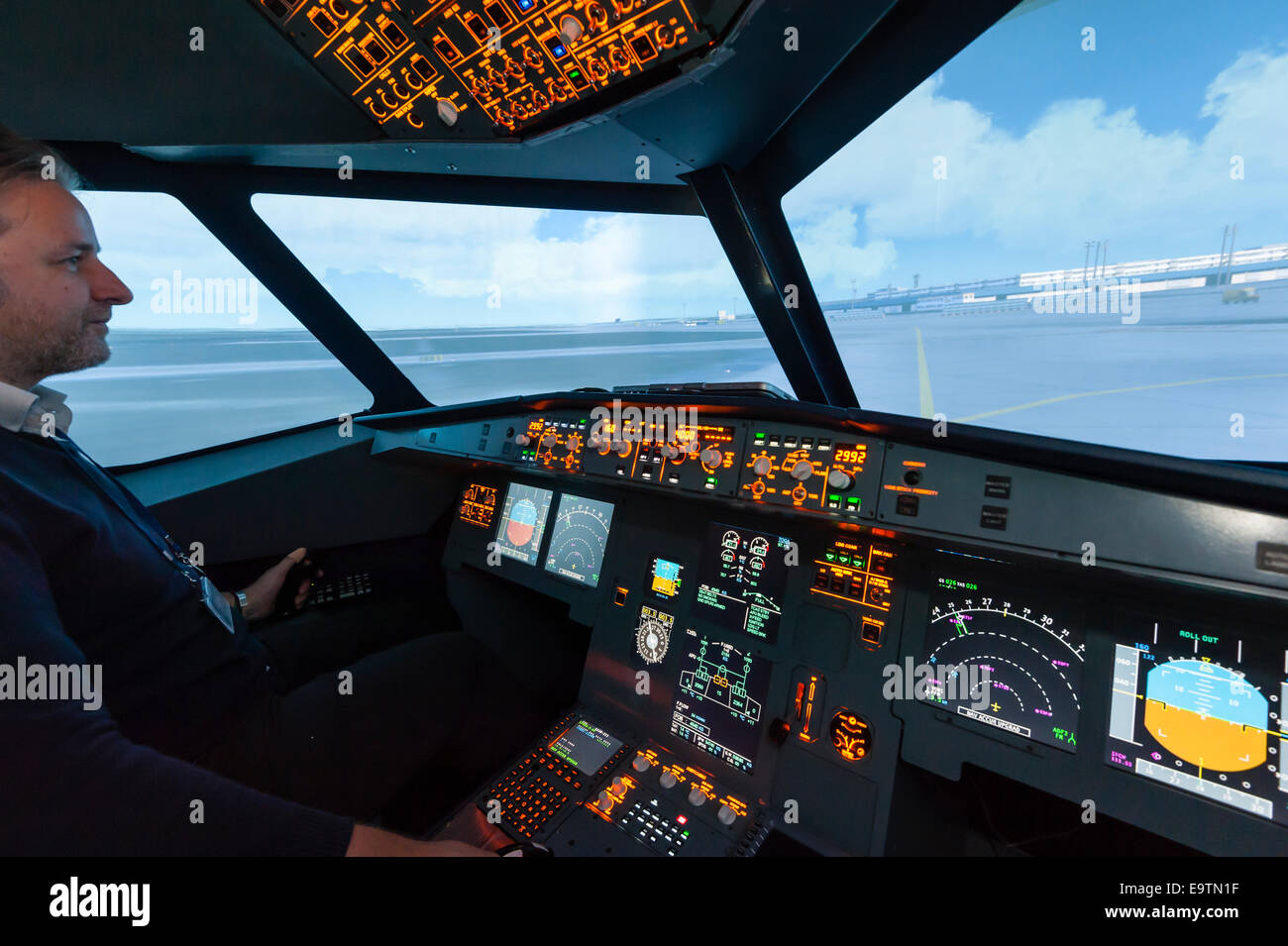 Cockpit of an Airbus A320 flight simulator that is used for training of professional airline pilots (preparing takeoff) Stock Photo
