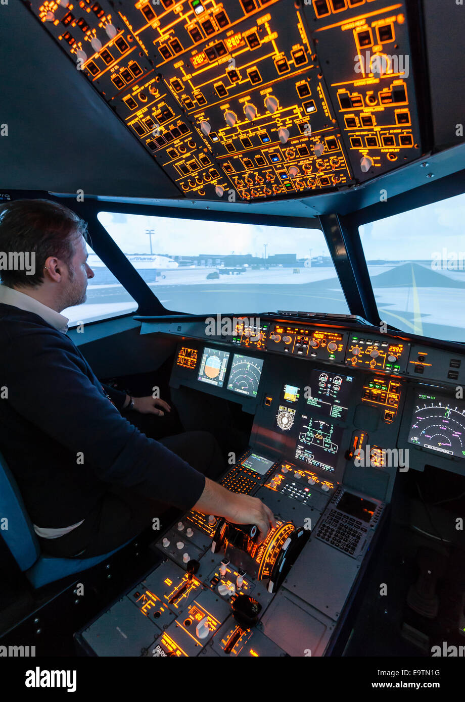 Cockpit of an Airbus A320 flight simulator that is used for training of professional airline pilots (preparing takeoff) Stock Photo